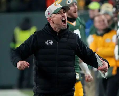 Jan 7, 2024; Green Bay, Wisconsin, USA; Green Bay Packers head coach Matt LaFleur celebrates as the clock winds down during the fourth quarter against the Chicago Bears at Lambeau Field. Mandatory Credit: Mark Hoffman-USA TODAY Sports