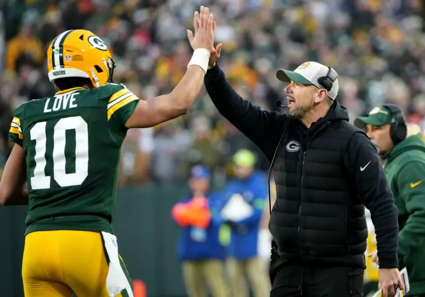 Green Bay Packers quarterback Jordan Love (10) high fives head coach Matt LaFleur after throwing a touchdown pass during the second quarter of their game against the Chicago Bear Sunday, January 7, 2024 at Lambeau Field in Green Bay, Wisconsin.© Mark Hoffman/Milwaukee Journal Sentinel / USA TODAY NETWORK