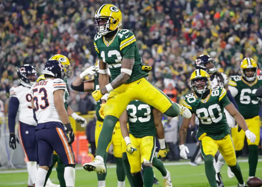 Green Bay Packers wide receiver Dontayvion Wicks (13) celebrates scoring a third quarter touchdown against the Chicago Bears during their football game Sunday, January 7, 2024, in Green Bay, Wisconsin. Dan Powers/USA TODAY NETWORK-Wisconsin.