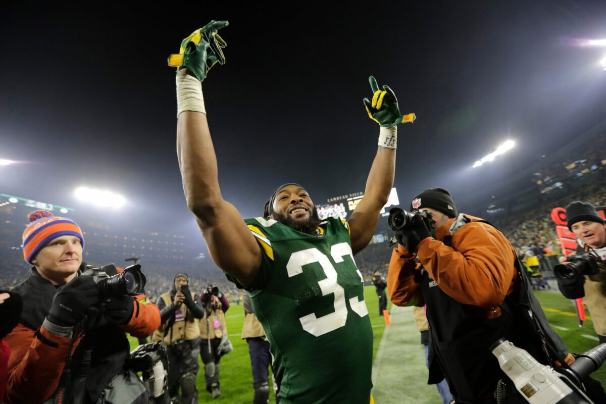 Green Bay Packers running back Aaron Jones (33) celebrates after defeating the Chicago Bears during their football game Sunday, January 7, 2024, in Green Bay, Wisconsin.