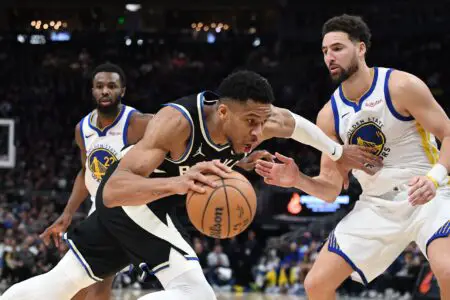 Jan 13, 2024; Milwaukee, Wisconsin, USA; Milwaukee Bucks forward Giannis Antetokounmpo (34) drives against Golden State Warriors guard Klay Thompson (11) in the second half at Fiserv Forum. Mandatory Credit: Michael McLoone-USA TODAY Sports
