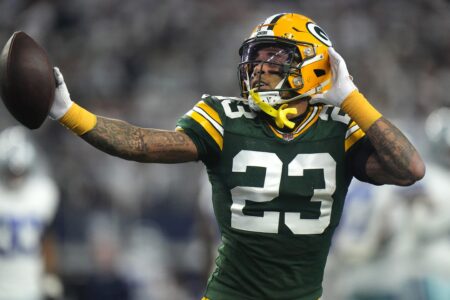 Green Bay Packers cornerback Jaire Alexander (23) reacts after intercepting a pass during the first quarter of the wild card playoff game against the Dallas Cowboys Sunday, January 14, 2024 at AT&T Stadium in Arlington, Texas.