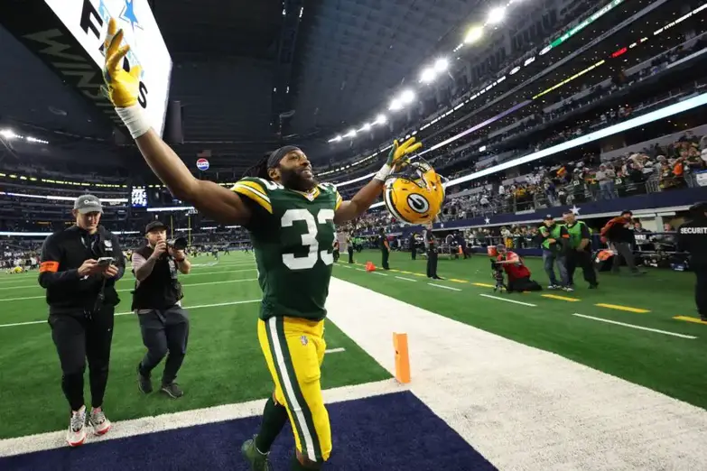 Jan 14, 2024; Arlington, Texas, USA; Green Bay Packers running back Aaron Jones (33) reacts after defeating the Dallas Cowboys in the 2024 NFC wild card game at AT&T Stadium. Mandatory Credit: Kevin Jairaj-USA TODAY Sports