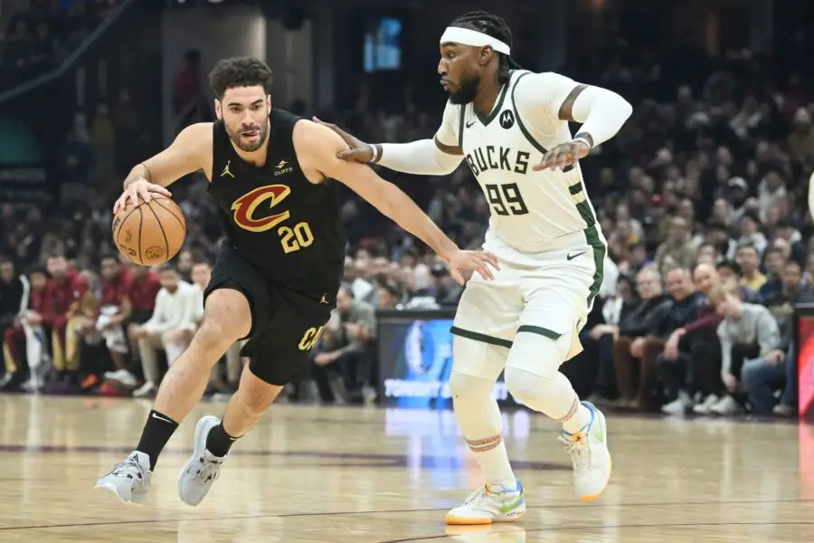 Jan 17, 2024; Cleveland, Ohio, USA; Cleveland Cavaliers forward Georges Niang (20) drives to the basket against Milwaukee Bucks forward Jae Crowder (99) during the first half at Rocket Mortgage FieldHouse. Mandatory Credit: Ken Blaze-USA TODAY Sports