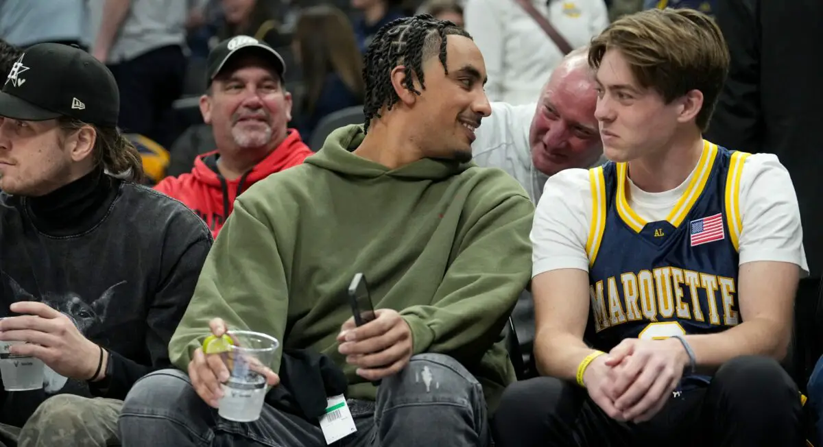 Green Bay Packers quarterback Jordan Love sits courtside at a Marquette game