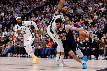 Jan 29, 2024; Denver, Colorado, USA; Denver Nuggets guard Jamal Murray (27) controls the ball against Milwaukee Bucks forward Giannis Antetokounmpo (34) as forward Jae Crowder (99) defends in the fourth quarter at Ball Arena. Mandatory Credit: Isaiah J. Downing-USA TODAY Sports