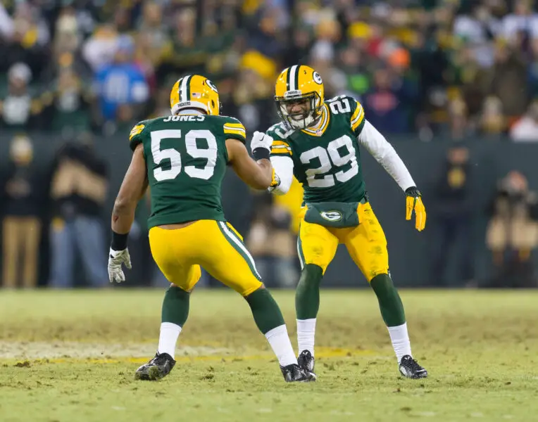 Dec 28, 2014; Green Bay, WI, USA; Green Bay Packers cornerback Casey Hayward (29) and linebacker Brad Jones (59) celebrate following a play during the game against the Detroit Lions at Lambeau Field. Green Bay won 30-20. Mandatory Credit: Jeff Hanisch-USA TODAY Sports
