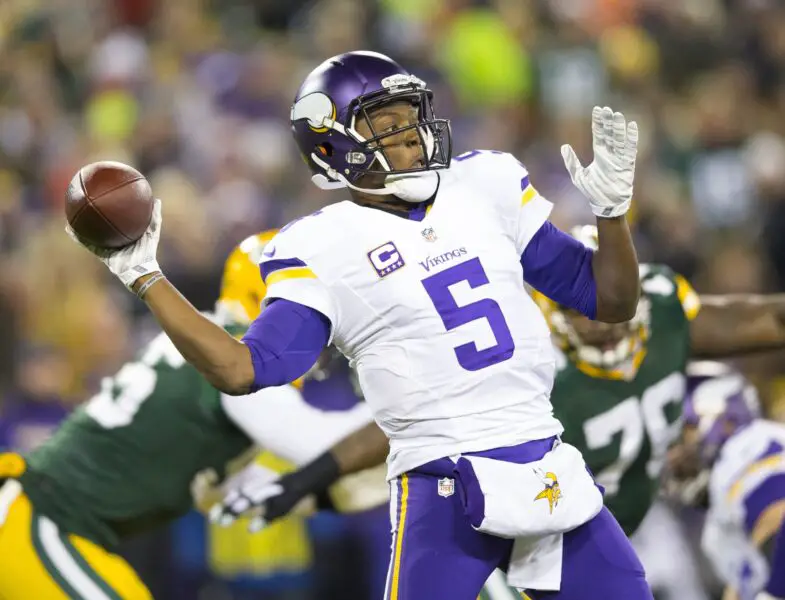 Jan 3, 2016; Green Bay, WI, USA; Minnesota Vikings quarterback Teddy Bridgewater (5) throws a pass during the first quarter against the Green Bay Packers at Lambeau Field. Mandatory Credit: Jeff Hanisch-USA TODAY Sports
