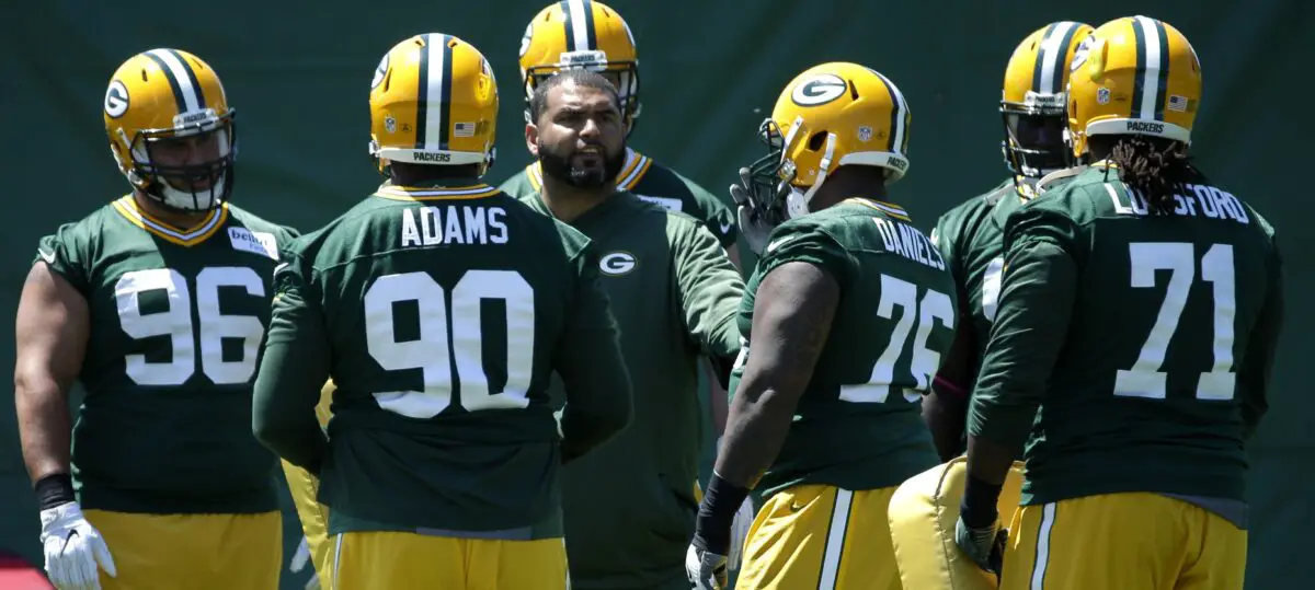 June 1, 2016; Green Bay, WI, USA; Green Bay Packers defensive front assistant Jerry Montgomery (C) huddles with players during organized team activities. Mandatory Credit: Mark Hoffman/Milwaukee Journal Sentinel via USA TODAY NETWORK