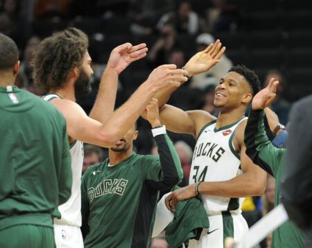 Oct 17, 2019; Milwaukee, WI, USA; Milwaukee Bucks forward Giannis Antetokounmpo (34) high-fives Milwaukee Bucks center Robin Lopez (42) after he hit two three-point shots in a row against the Minnesota Timberwolves in the fourth quarter at Fiserv Forum. Milwaukee Bucks won 118-96. Mandatory Credit: Michael McLoone-USA TODAY Sports