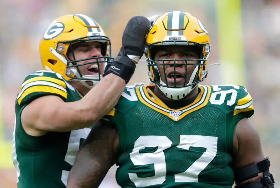Green Bay Packers nose tackle Kenny Clark (97) celebrates his first quarter sack with Blake Martinez (50) against the Washington Redskins during their football game Sunday, December 8, 2019, at Lambeau Field in Green Bay,, Wis. Dan Powers/USA TODAY NETWORK-Wisconsin