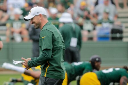 Head coach Matt LaFleur laughs during warmups during Green Bay Packers training camp at Ray Nitschke Field Friday, July 26, 2019, in Green Bay, Wis. © Joshua Clark/USA TODAY NETWORK-Wis. via Imagn Content Services via Imagn Content Services, LLC