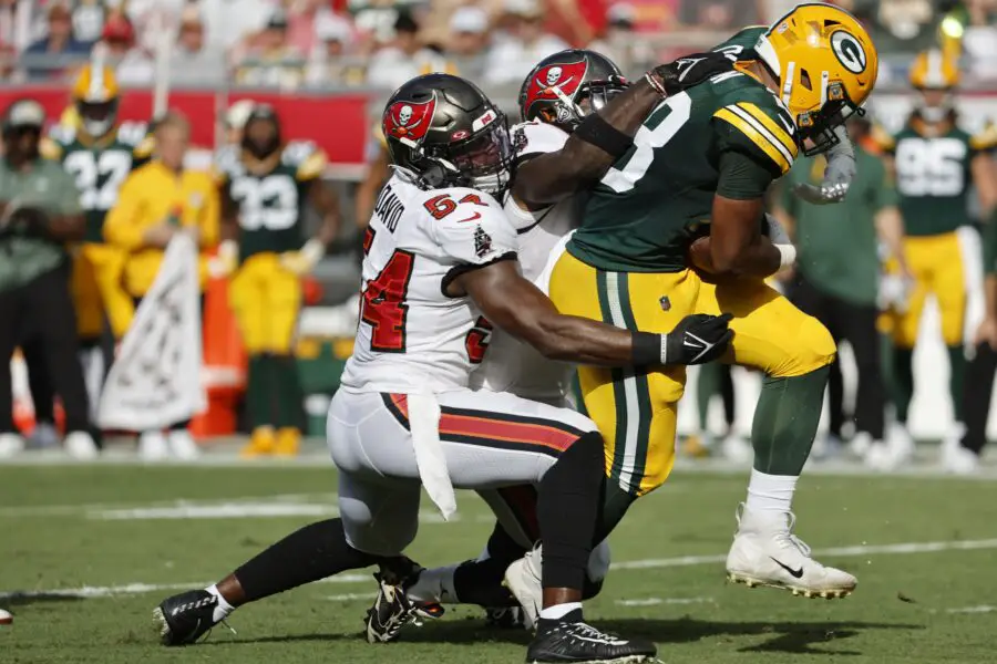 Sep 25, 2022; Tampa, Florida, USA; Tampa Bay Buccaneers linebacker Lavonte David (54) and linebacker Devin White (45) tackle Green Bay Packers running back AJ Dillon (28) during the second quarter at Raymond James Stadium. Mandatory Credit: Kim Klement-USA TODAY Sports