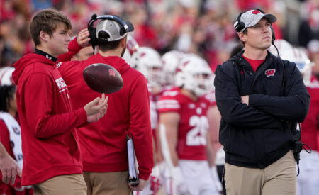 Nov 26, 2022; Madison, Wisconsin, USA; Wisconsin head coach Jim Leonhard, right, is shown during the first quarter of their game against Minnesota at Camp Randall Stadium. Mandatory Credit: Mark Hoffman-USA TODAY Sports