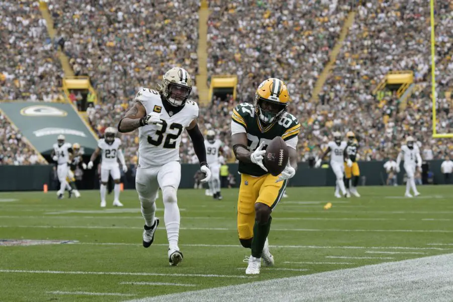 Sep 24, 2023; Green Bay, Wisconsin, USA; Green Bay Packers wide receiver Romeo Doubs (87) catches a pass in front of New Orleans Saints safety Tyrann Mathieu (32) during the third quarter at Lambeau Field. Mandatory Credit: Jeff Hanisch-USA TODAY Sports Sep 24, 2023; Green Bay, Wisconsin, USA; Green Bay Packers wide receiver Romeo Doubs (87) catches a pass in front of New Orleans Saints safety Tyrann Mathieu (32) during the third quarter at Lambeau Field. Mandatory Credit: Jeff Hanisch-USA TODAY Sports