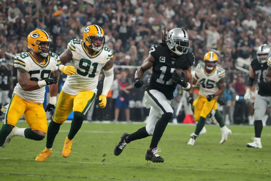 Oct 9, 2023; Paradise, Nevada, USA; Las Vegas Raiders wide receiver Davante Adams (17) is pursued by Green Bay Packers linebacker Preston Smith (91) and linebacker De'Vondre Campbell (59) in the second half at Allegiant Stadium. Mandatory Credit: Kirby Lee-USA TODAY Sports