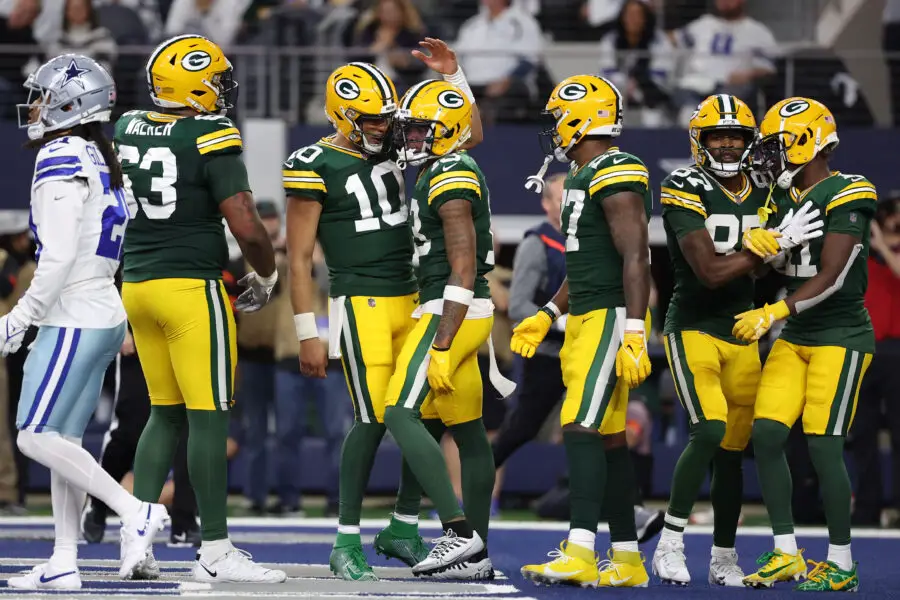 Jan 14, 2024; Arlington, Texas, USA; Green Bay Packers quarterback Jordan Love (10) reacts with wide receiver Dontayvion Wicks (13) after a touchdown catch in the first half of the 2024 NFC wild card game at AT&T Stadium. Mandatory Credit: Kevin Jairaj-USA TODAY Sports