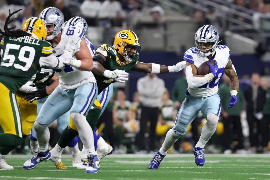 Jan 14, 2024; Arlington, Texas, USA; Dallas Cowboys running back Tony Pollard (20) rushes the ball against the Green Bay Packers in the second half for the 2024 NFC wild card game at AT&T Stadium. Mandatory Credit: Kevin Jairaj-USA TODAY Sports