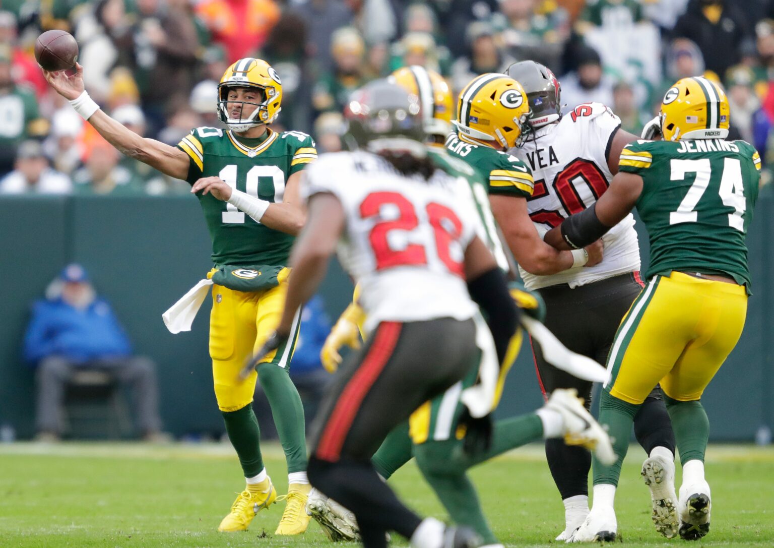 Green Bay Packers quarterback Jordan Love (10) passes the ball to wide receiver Jayden Reed (11) against the Tampa Bay Buccaneers during their football game Sunday, December 17, 2023, at Lambeau Field in Green Bay, Wis. © Dan Powers/USA TODAY NETWORK-Wisconsin / USA TODAY NETWORK