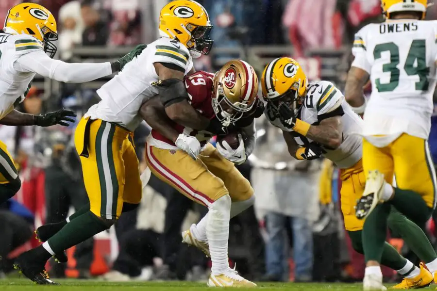 January 20, 2024; Santa Clara, CA, USA; Green Bay Packers linebacker De’Vondre Campbell (59) and linebacker Quay Walker (7) and cornerback Jaire Alexander (23) tackle San Francisco 49ers wide receiver Deebo Samuel (19) in the during the second quarter in a 2024 NFC divisional round game at Levi’s Stadium. Mandatory Credit: Kyle Terada-USA TODAY Sports
