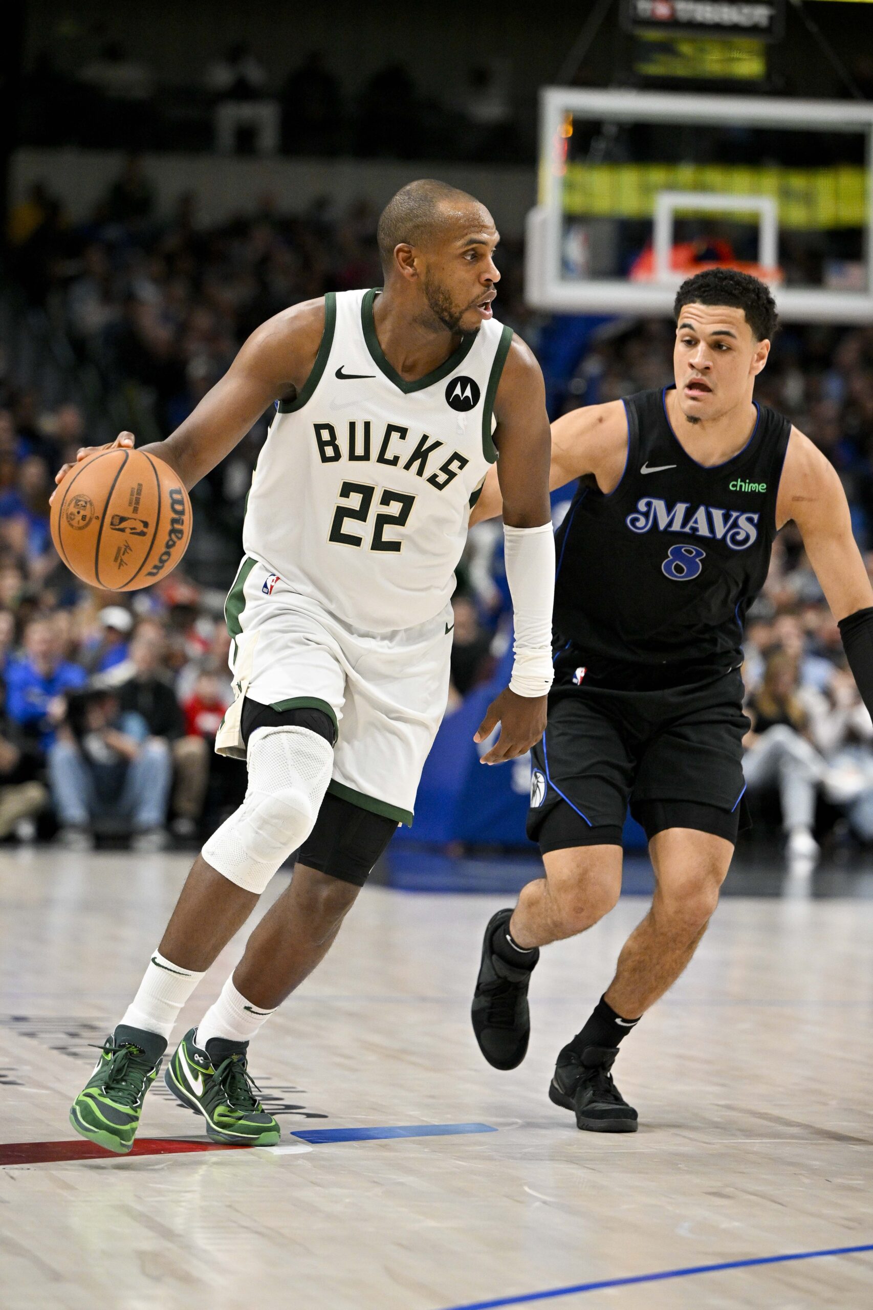 Feb 3, 2024; Dallas, Texas, USA; Milwaukee Bucks forward Khris Middleton (22) and Dallas Mavericks guard Josh Green (8) in action during the game between the Dallas Mavericks and the Milwaukee Bucks at the American Airlines Center. Mandatory Credit: Jerome Miron-USA TODAY Sports