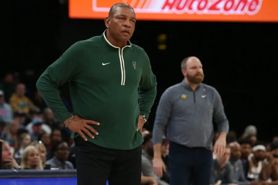 Feb 15, 2024; Memphis, Tennessee, USA; Milwaukee Bucks head coach Doc Rivers (left) and Memphis Grizzlies head coach Taylor Jenkins (right) watch during the second half at FedExForum. Mandatory Credit: Petre Thomas-USA TODAY Sports