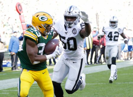 Green Bay Packers running back Aaron Jones (33) scores a touchdown reception against Oakland Raiders linebacker Nicholas Morrow (50) in the first quarter Sunday, October 20, 2019, at Lambeau Field in Green Bay, Wis. Dan Powers/USA TODAY NETWORK-Wisconsin
