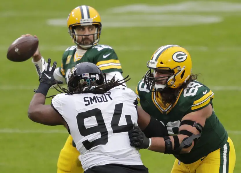 Green Bay Packers defensive tackle David Bakhtiari (69) blocks Jacksonville Jaguars defensive end Dawuane Smoot (94)) as quarterback Aaron Rodgers (12) looks to pass Sunday, November 15, 2020, at Lambeau Field in Green Bay, Wis. © Dan Powers/USA TODAY NETWORK-Wis via Imagn Content Services, LLC