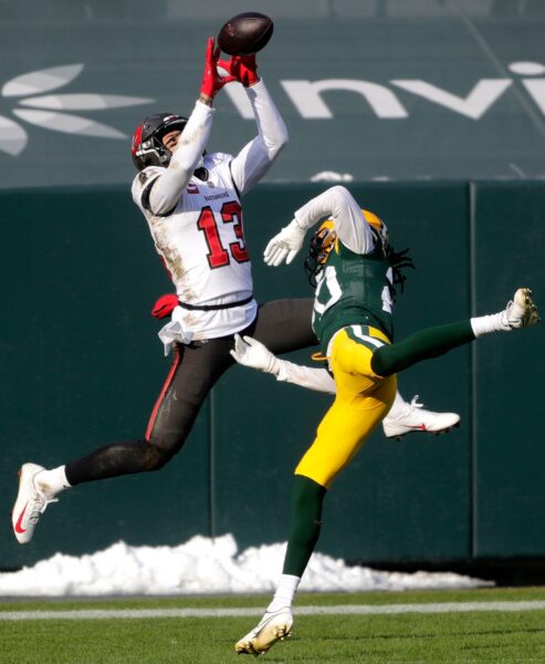 Tampa Bay Buccaneers wide receiver Mike Evans (13) catches a touchdown pass over then defense of Green Bay Packers cornerback Kevin King (20) during the NFC Championship game on Sunday, January 24, 2021, at Lambeau Field in Green Bay, Wis.Wm. Glasheen USA TODAY NETWORK-Wisconsin