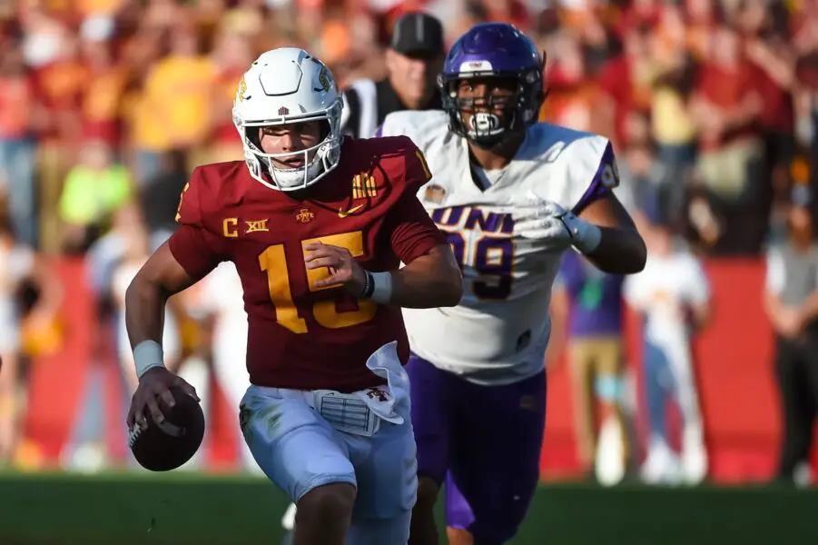 Sep 4, 2021; Ames, Iowa, USA;  Iowa State Cyclones quarterback Brock Purdy (15) runs from Northern Iowa Panthers defensive lineman Khristian Boyd (99) in the second half at Jack Trice Stadium. Mandatory Credit: Steven Branscombe-USA TODAY Sports