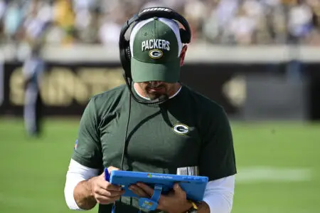 Sep 12, 2021; Jacksonville, Florida, USA; Green Bay Packers head coach Matt LaFleur walks down the sidelines looking at a tablet during the first half against the New Orleans Saints at TIAA Bank Field. Mandatory Credit: Tommy Gilligan-USA TODAY Sports
