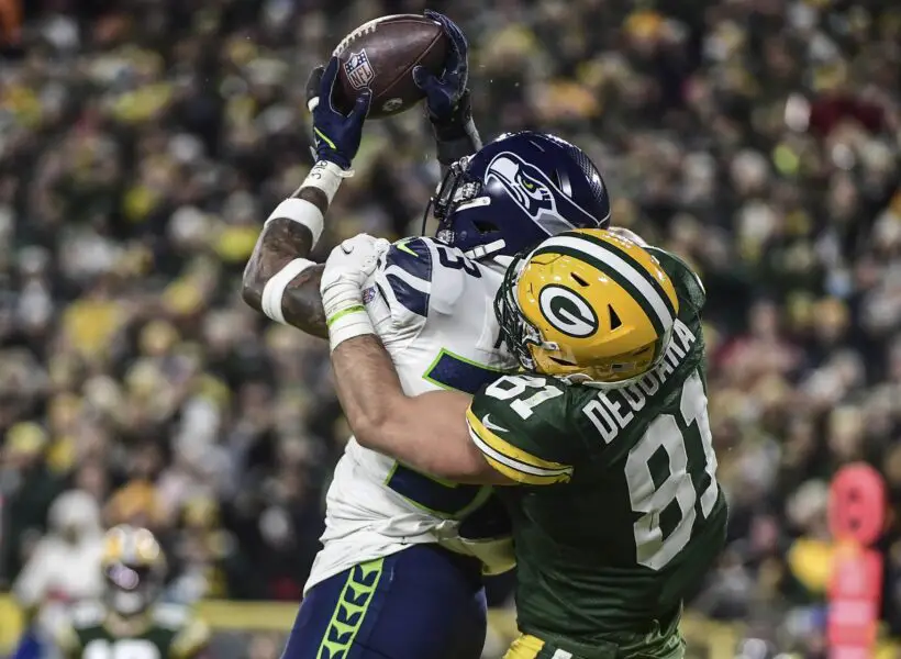 Nov 14, 2021; Green Bay, Wisconsin, USA; Seattle Seahawks safety Jamal Adams (33) intercepts a pass intended for Green Bay Packers tight end Josiah Deguara (81) in the third quarter at Lambeau Field. Mandatory Credit: Benny Sieu-USA TODAY Sports