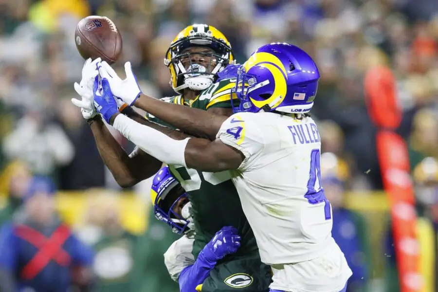Nov 28, 2021; Green Bay, Wisconsin, USA;  Los Angeles Rams safety Jordan Fuller (4) breaks up the pass intended for Green Bay Packers wide receiver Marquez Valdes-Scantling (83) during the second quarter at Lambeau Field. Mandatory Credit: Jeff Hanisch-USA TODAY Sports