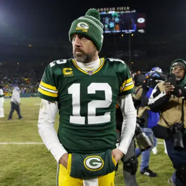 Jan 8, 2023; Green Bay, Wisconsin, USA; Green Bay Packers quarterback Aaron Rodgers (12) walks off the field following the game against the Detroit Lions at Lambeau Field. Mandatory Credit: Jeff Hanisch-USA TODAY Sports