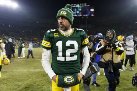 Jan 8, 2023; Green Bay, Wisconsin, USA; Green Bay Packers quarterback Aaron Rodgers (12) walks off the field following the game against the Detroit Lions at Lambeau Field. Mandatory Credit: Jeff Hanisch-USA TODAY Sports