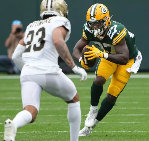 Sep 24, 2023; Green Bay, Wisconsin, USA; Green Bay Packers running back Patrick Taylor (27) makes a move on New Orleans Saints cornerback Marshon Lattimore (23) during the third quarter of their game Sunday, September 24, 2023 at Lambeau Field in Green Bay, Wis. The Green Bay Packers beat the New Orleans Saints 18-17. Mandatory Credit: Mark Hoffman-USA TODAY Sports