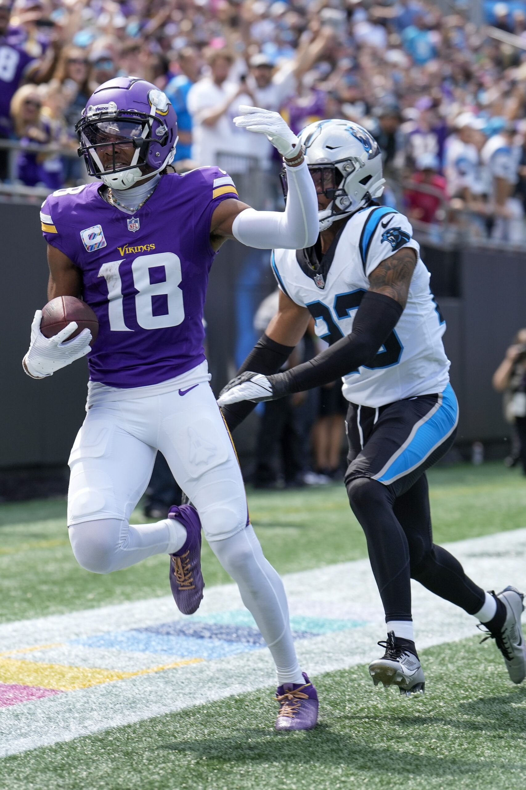 Oct 1, 2023; Charlotte, North Carolina, USA; Minnesota Vikings wide receiver Justin Jefferson (18) in the end zone past Carolina Panthers cornerback CJ Henderson (23) during the first quarter at Bank of America Stadium. Mandatory Credit: Jim Dedmon-USA TODAY Sports (Green Bay Packers)