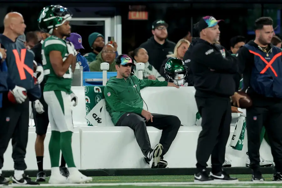 Oct 15, 2023; East Rutherford, New Jersey, USA; New York Jets injured quarterback Aaron Rodgers sits on the bench during the fourth quarter against the Philadelphia Eagles at MetLife Stadium. Mandatory Credit: Brad Penner-USA TODAY Sports (Green Bay Packers)