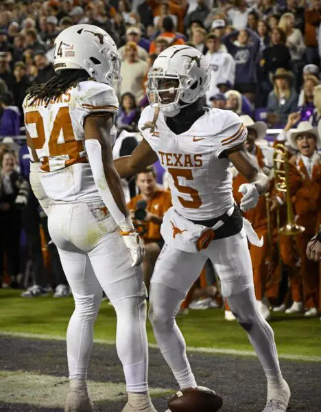 Nov 11, 2023; Fort Worth, Texas, USA; Texas Longhorns wide receiver Adonai Mitchell (5) and running back Jonathon Brooks (24) celebrates a touchdown during the game between the TCU Horned Frogs and the Texas Longhorns at Amon G. Carter Stadium. Mandatory Credit: Jerome Miron-USA TODAY Sports
