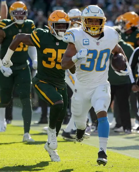 Los Angeles Chargers running back Austin Ekeler (30) picks up 37 yards on a run during the first quarter of their game against the Green Bay Packers Sunday, November 19, 2023 at Lambeau Field in Green Bay, Wisconsin. © Mark Hoffman/Milwaukee Journal Sentinel / USA TODAY NETWORK
