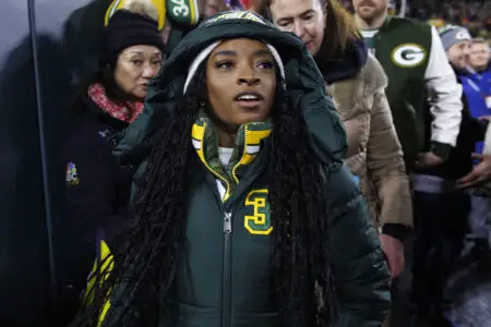 Dec 3, 2023; Green Bay, Wisconsin, USA; Simone Biles looks on during warmups prior to the game between the Kansas City Chiefs and Green Bay Packers at Lambeau Field. Mandatory Credit: Jeff Hanisch-USA TODAY Sports