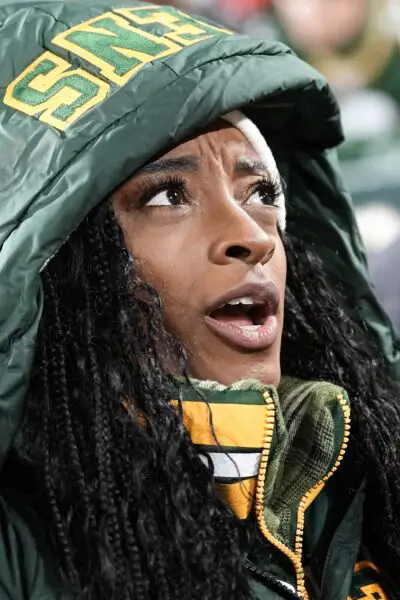 Dec 3, 2023; Green Bay, Wisconsin, USA; Gymnast Simone Biles looks on during warmups prior to the game between the Kansas City Chiefs and Green Bay Packers at Lambeau Field. Mandatory Credit: Jeff Hanisch-USA TODAY Sports
