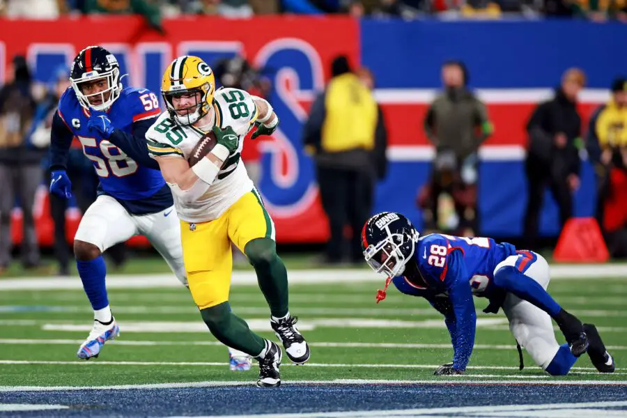 Dec 11, 2023; East Rutherford, New Jersey, USA; Green Bay Packers linebacker Isaiah McDuffie (58) runs with the ball against New York Giants linebacker Bobby Okereke (58) and cornerback Cor'Dale Flott (28) during the fourth quarter at MetLife Stadium. Mandatory Credit: Vincent Carchietta-USA TODAY Sports