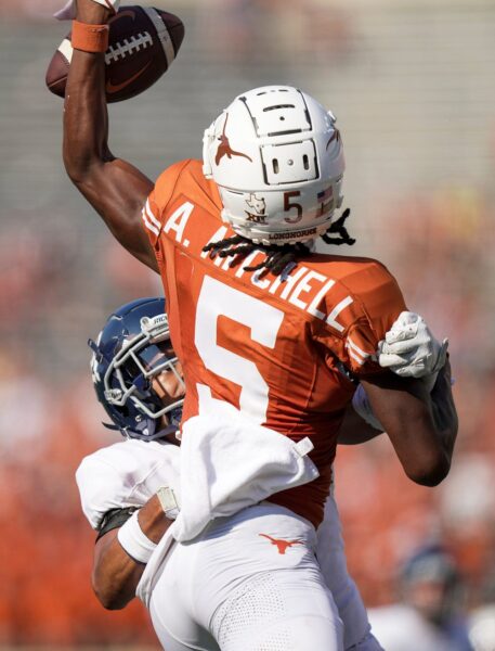 Texas Longhorns wide receiver Adonai Mitchell (5) tries to pull the ball in for a catch but failed as Rice Owls cornerback Lamont Narcisse (13) defends on the play in the third quarter of an NCAA college football game, Saturday, Sept. 2, 2023, in Austin, Texas. © Ricardo Brazziell / USA TODAY NETWORK (Green Bay Packers)