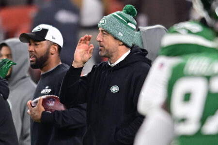 Dec 28, 2023; Cleveland, Ohio, USA; New York Jets quarterback Aaron Rodgers (center) looks on before the game between the Cleveland Browns and the Jets at Cleveland Browns Stadium. Mandatory Credit: Ken Blaze-USA TODAY Sports