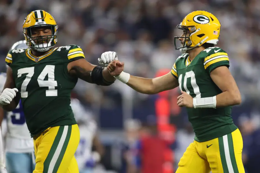 Jan 14, 2024; Arlington, Texas, USA; Green Bay Packers quarterback Jordan Love (10) reacts with guard Elgton Jenkins (74) during the second half for the 2024 NFC wild card game at AT&T Stadium. Mandatory Credit: Tim Heitman-USA TODAY Sports
