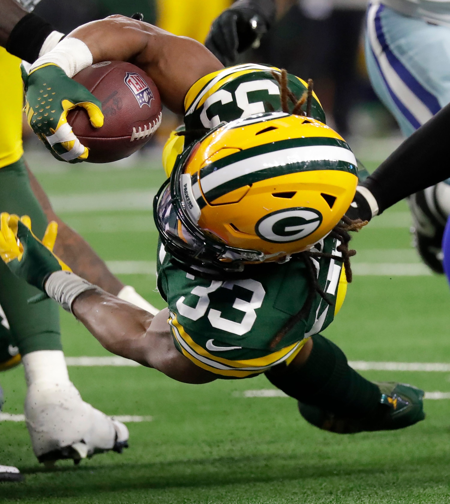 Green Bay Packers running back Aaron Jones (33) dives for a touchdown against the Dallas Cowboys during the second quarter of their wild card playoff game Sunday, January 14, 2024 at AT&T Stadium in Arlington, Texas.