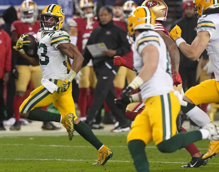 Green Bay Packers running back Aaron Jones (33) picks up 53 yards on a run during the fourth quarter of their NFC divisional playoff game Saturday, January 20, 2024 at Levi’ Stadium in Santa Clara, California. The San Francisco 49ers beat the Green Bay Packers 24-21.