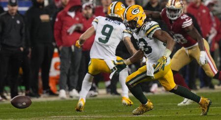 Green Bay Packers running back Aaron Jones (33) recovers a fumble during the third quarter of their NFC divisional playoff game Saturday, January 20, 2024 at Levi’ Stadium in Santa Clara, California. The San Francisco 49ers beat the Green Bay Packers 24-21.