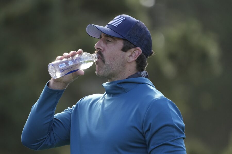 Feb 1, 2024; Pebble Beach, California, USA; New York Jets quarterback Aaron Rodgers drinks water on the 11th hole during the first round of the AT&T Pebble Beach Pro-Am golf tournament at Spyglass Hill Golf Course. Mandatory Credit: Michael Madrid-USA TODAY Sports (Green Bay Packers)